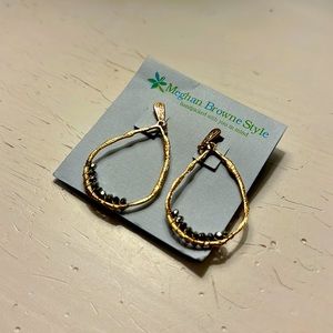 Gold hanging earrings with greg/silver crystal detail